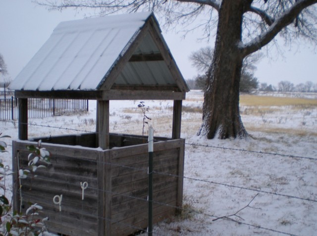 Cold weather and snow covering cistern cover. #TexasHomesteader