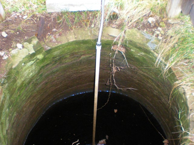 Deep underground cement cistern captures rainwater for garden irrigation. #TexasHomesteader