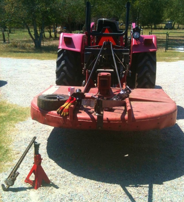 repairing brokenn tractor. Being a farmer or rancher is a labor of love. #TexasHomesteader