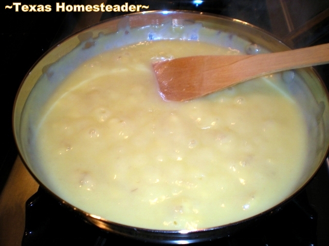 Simmering homemade banana pudding ingredients in a stainless steel skillet. #TexasHomesteader