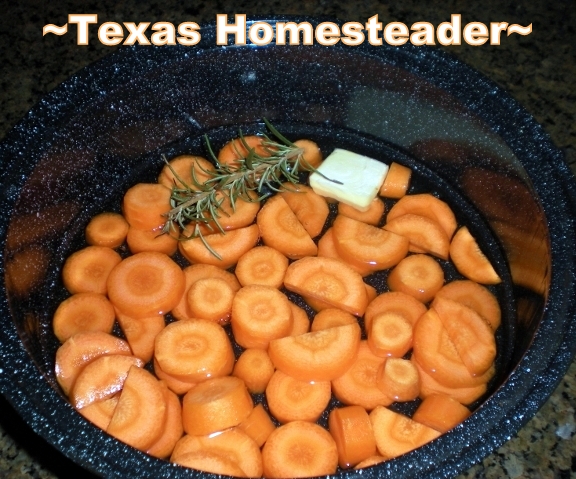 Fresh carrots cut into rounds and flavored with a pat of butter and a sprig of fresh rosemary. #TexasHomesteader