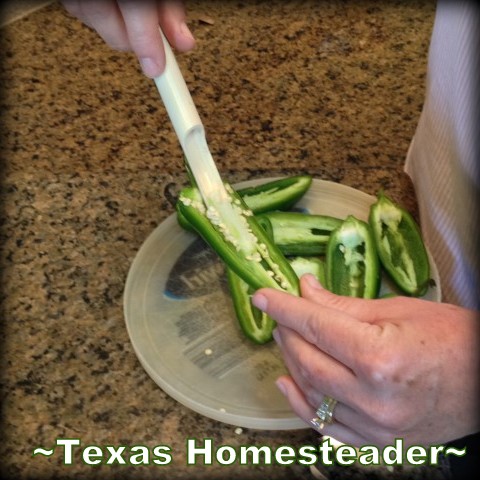 Taking seeds out of a fresh jalapeno to reduce the spiciness. #TexasHomesteader