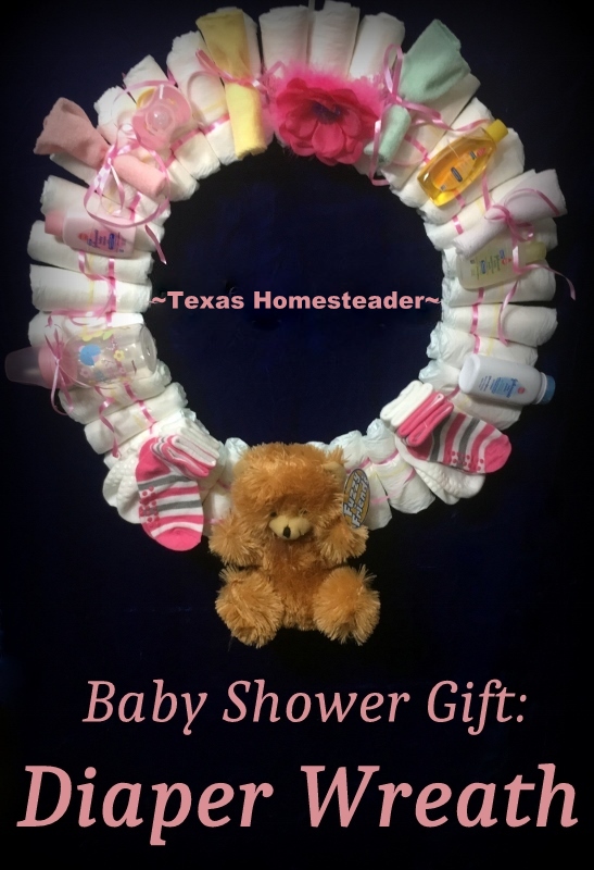 An easy diaper wreath, customizable for either boy or girl. A decorative (yet useful) gift presented beautifully! #TexasHomesteader