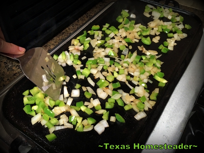 Grilling peppers and onions on a two-burner cast iron griddle. #TexasHometeader