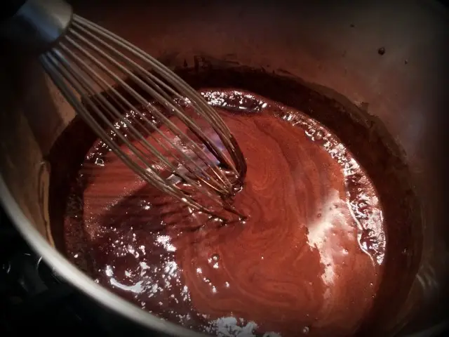 Homemade hot cocoa is delicious & only uses cocoa, sugar & milk - flavored with vanilla & a few miniature marshmallows floating on top. #TexasHomesteader