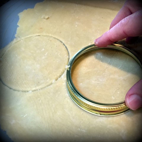 Cut crust with canning ring. Single-Serving Apple Pies baked in individual wide-mouth canning jars. They were delicious and oh-so-cute!  But mason jars are not made of tempered glass and should not be used to bake in the oven. #TexasHomesteader