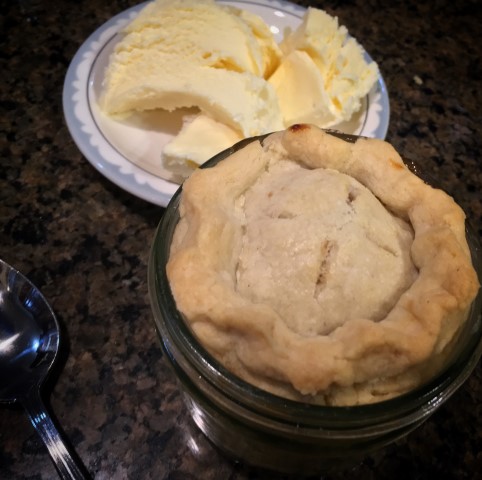 Single-Serving Apple Pies baked in individual wide-mouth canning jars. They were delicious and oh-so-cute! But mason jars are not made of tempered glass and should not be used to bake in the oven. #TexasHomesteader