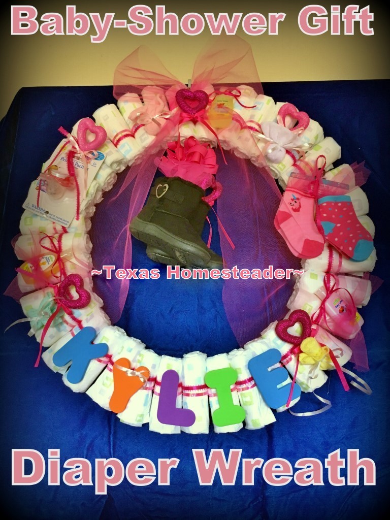 Cute Diaper Wreath Gift For Baby. This gift didn't cost much money but it was hand-made with much love. Items can be pulled from the wreath as needed. #TexasHomesteader