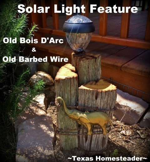 Solar light feature using old, aged Bois D'Arc wood and rustic old 1880's barbed wire, a metal elephant embellishment and decorative solar light. Perfect! #TexasHomesteader