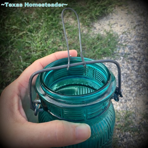 Making a hanging loop on my candle jar. I used an old broken flip-top jar, some gravel and a small votive candle to make the cutest porch lantern ever. Come see! #TexasHomesteader