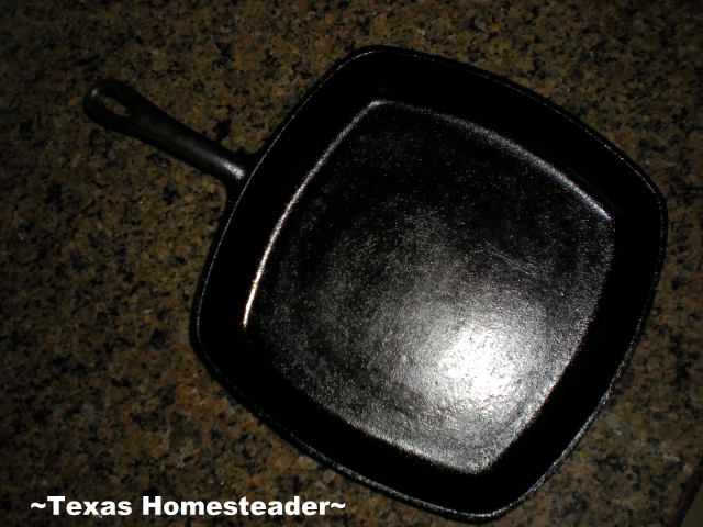 Antique cast-iron skillet. Stuck-on food frustrating you while cleaning your cast-iron skillet? I've found an EASY way to get it clean. Check out my lazy-cook's method! #TexasHomesteader
