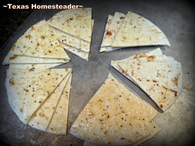 Cutting oiled tortillas. MYO baked pita chips using only 6 flour tortillas! A nice, heavy chip that holds up to dips or hummus. Nice & crispy too. Come see! #TexasHomesteader