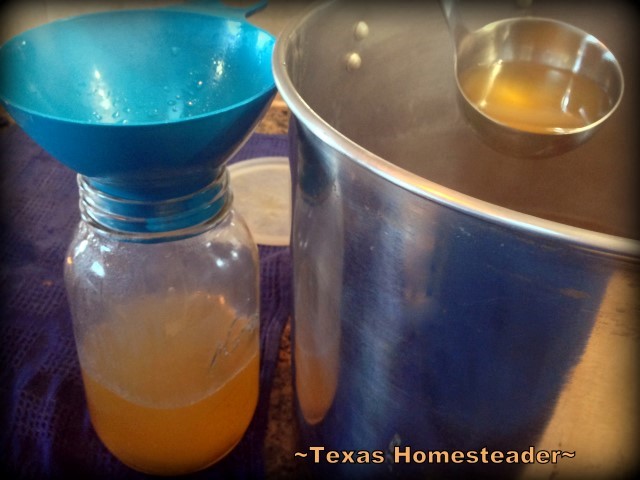 Ladle hot broth into clean canning jars. Preserve your homemade broth. Use a pressure canner when canning broth. It's easy and your reward is jars of homemade broth for months #TexasHomesteader
