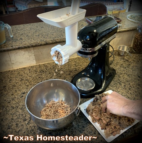 Grinding the shredded pork. It's time consuming to make homemade tamales. But it's very easy. Come see my step-by-step directions complete with photos and recipe. #TexasHomesteader