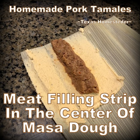 Placing meat in on the masa dough. It's time consuming to make homemade tamales. But it's very easy. Come see my step-by-step directions complete with photos and recipe. #TexasHomesteader