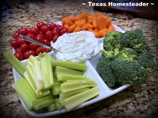 Fresh vegetables broccoli, carrots, tomatoes and celery on a white plate with ranch dip. #TexasHomesteader