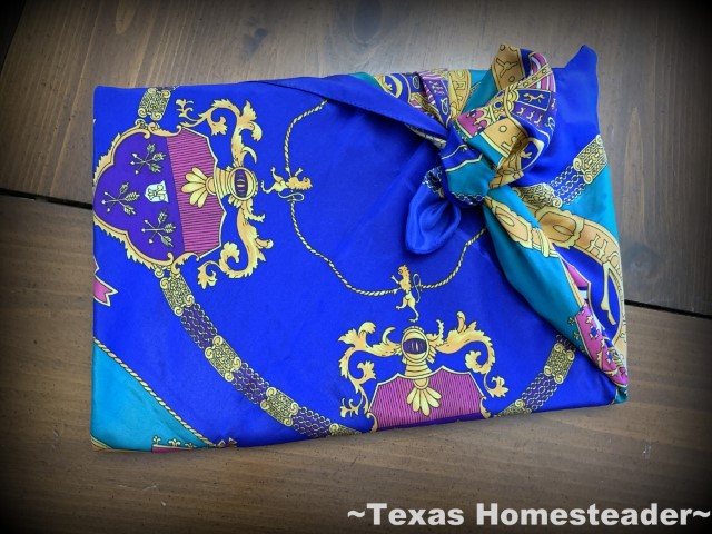 Zero Waste gift wrapping in cloth - this book wrapped Furoshiki style in bright festive reusable fabric. #TexasHomesteader