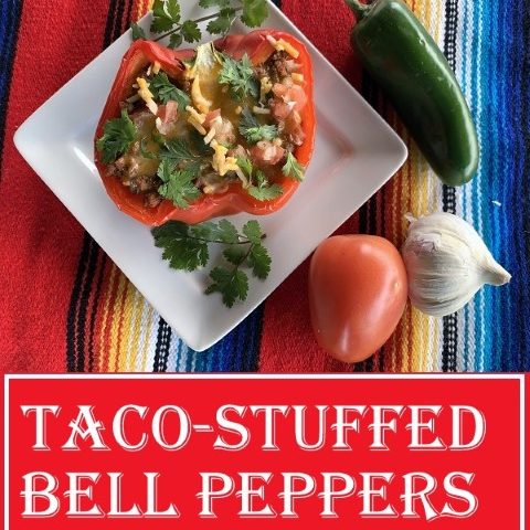 Taco stuffed red bell peppers on white square plate, cilantro garnish, garlic, jalapeno and tomato. #TexasHomesteader