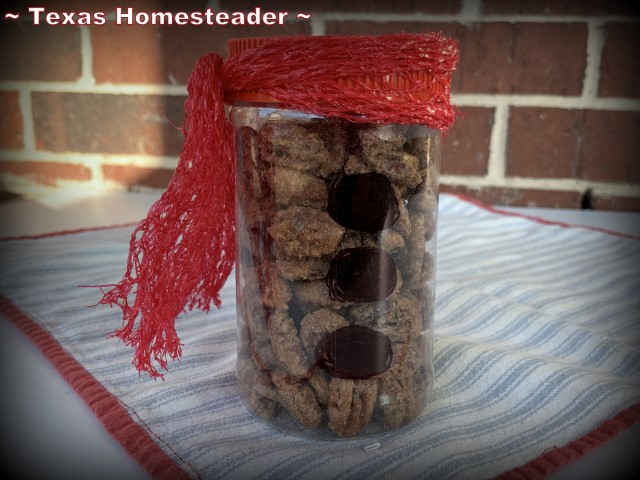Candied pecans - sugar and cinnamon placed in repurposed peanut butter jar with buttons & red scarf Christmas gift idea. #TexasHomesteader
