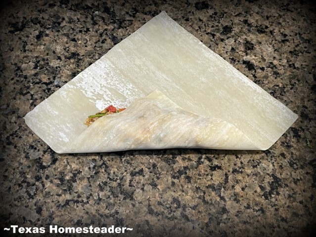 How To Roll An Egg Roll Wrapper - Wrap filling with bottom point. #TexasHomesteader