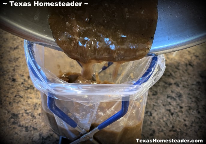 Mason jar canning jar lifter used to hold reusable zipper plastic bag open for pouring gravy. #TexasHomesteader