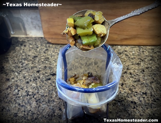 Mason jar canning jar lifter used to hold reusable zipper plastic bag open for roasted vegetables. #TexasHomesteader