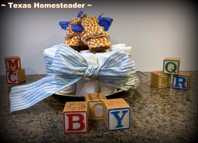 Baby shower - diaper cake with giraffe booties and wood blocks. #TexasHomesteader